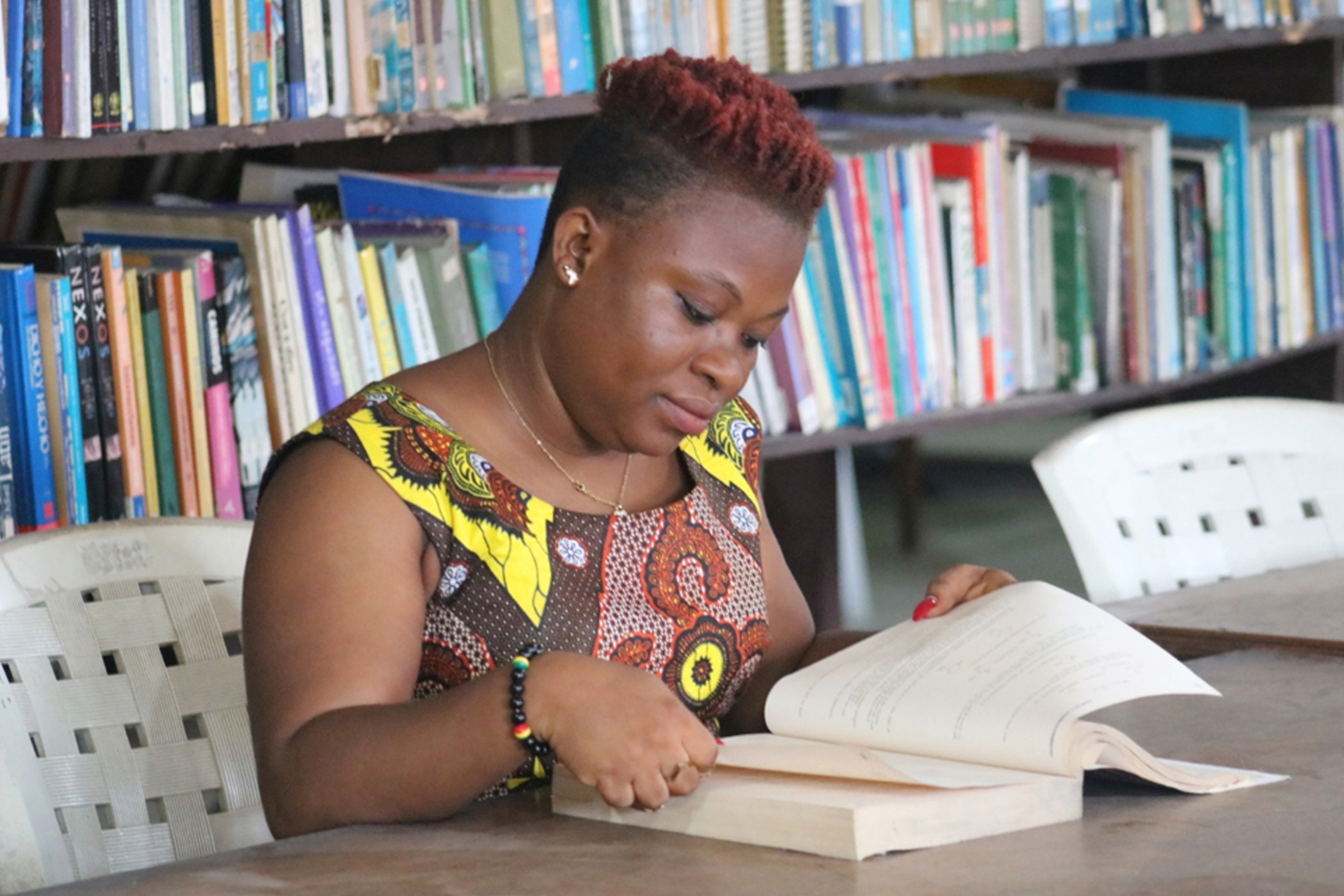 Edwina C. Togba, 39, studies. She is a student at the United Methodist University of Liberia, which she attends with support from a scholarship from United Women in Faith.