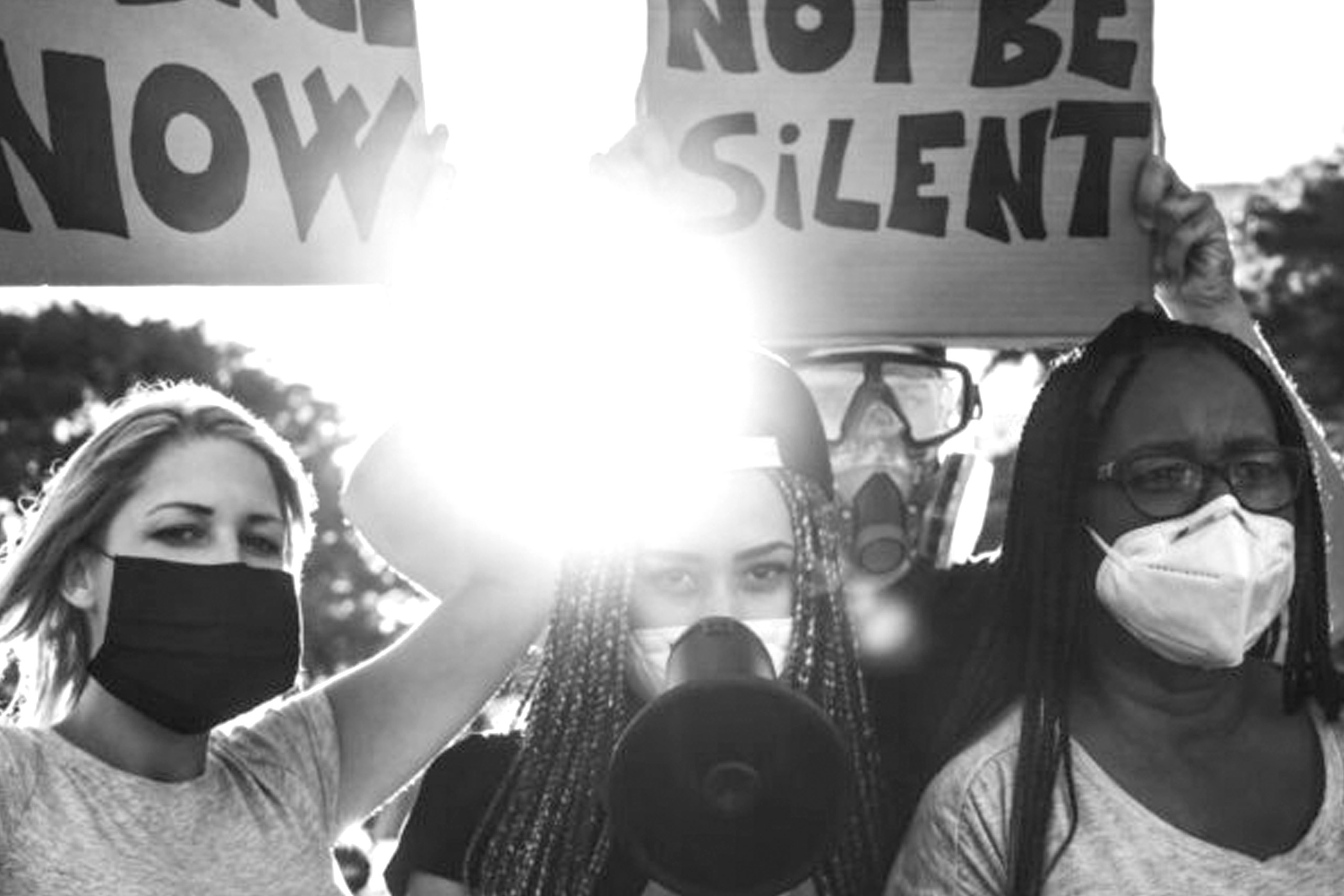 Black and white photo of two women at a protest