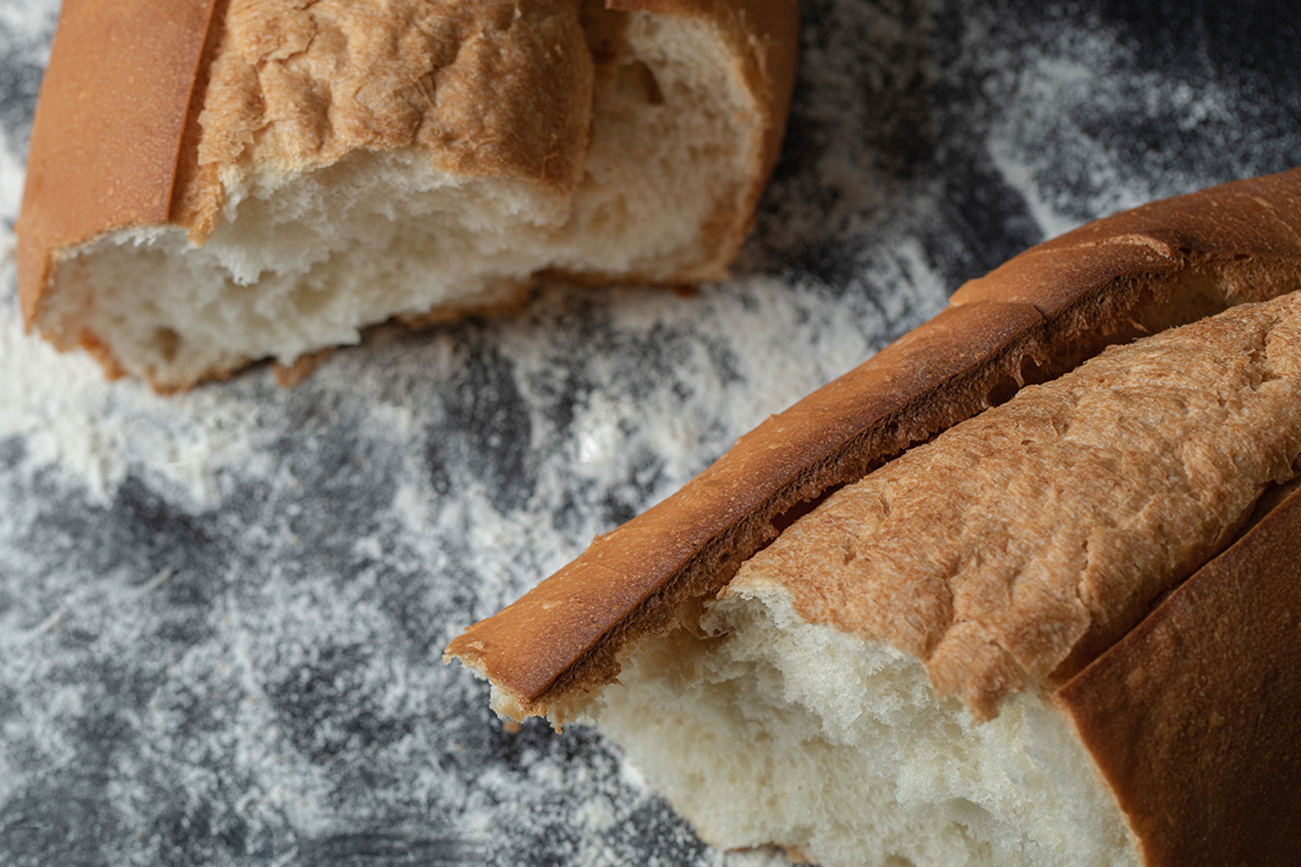 loaf of bread broken in half